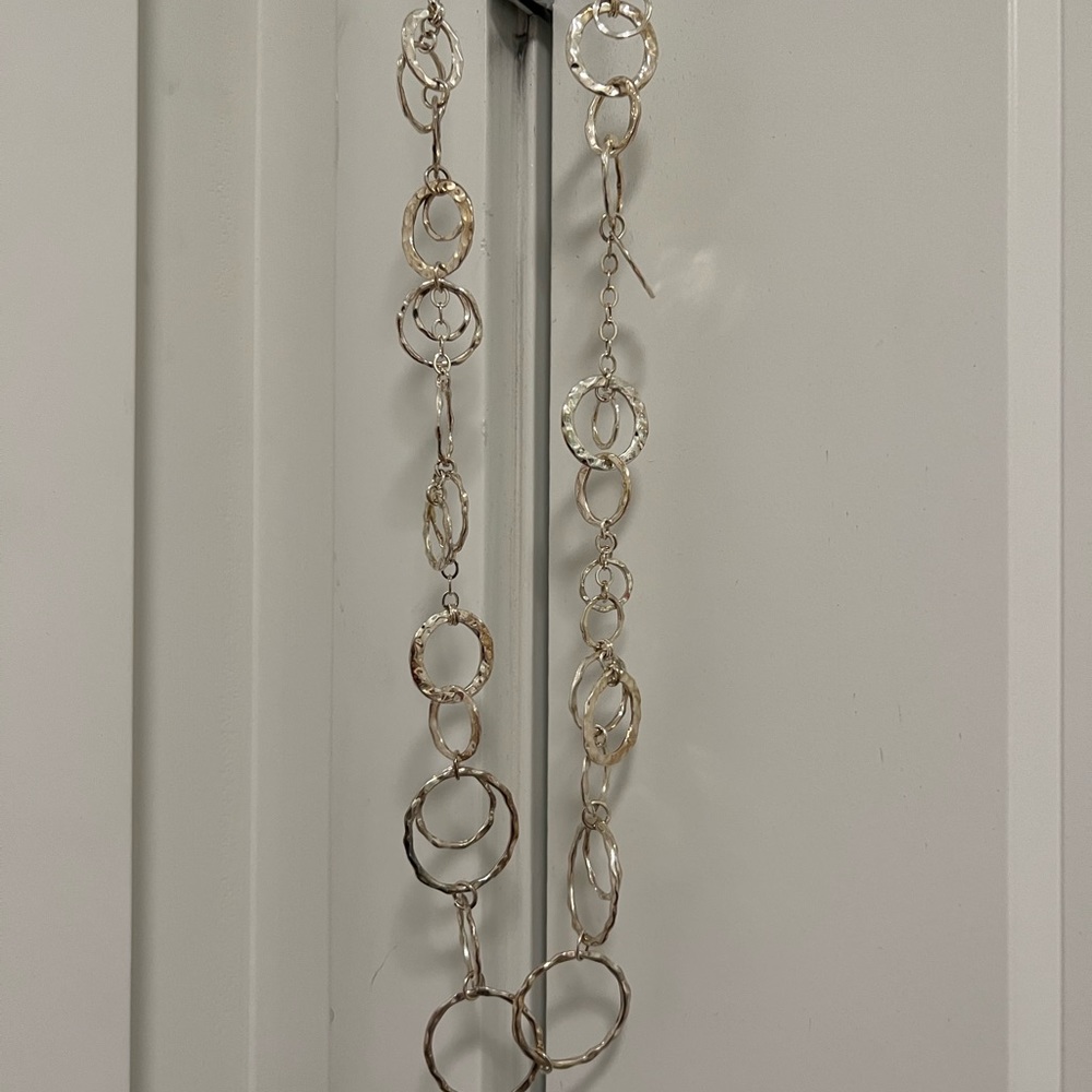 New without tags, Silver color round hammered long necklace.